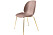 Ljusrosa stol i exklusiv design med ben i mässing.