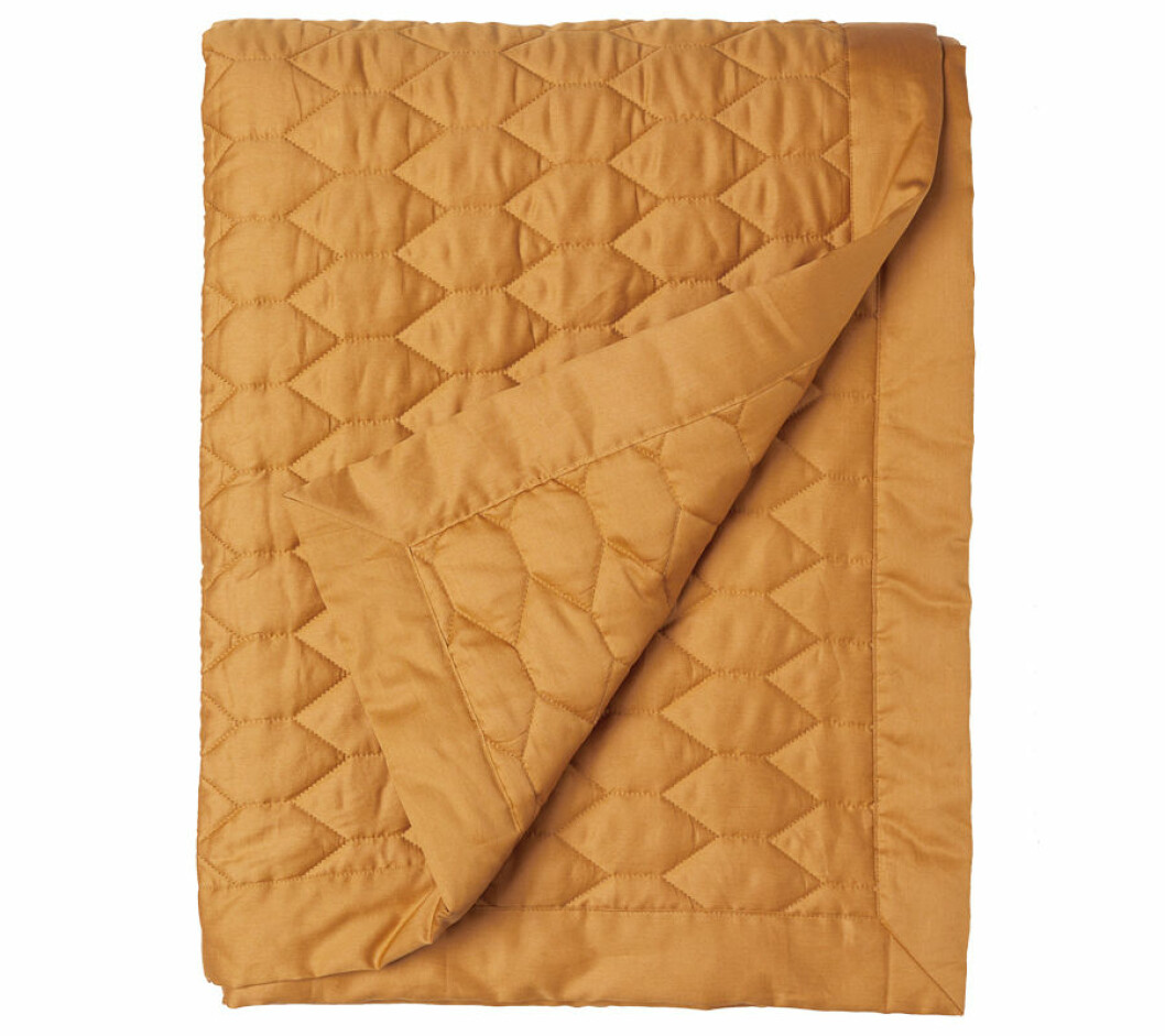 Quiltat gult överkast från H&M Home.-