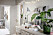 Scandinavian interior inspiration and ideas with light painted walls and green plants.