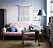 Livingroom with pink sofa, blue pinted walls and macramé. Scandinavian interior styling ideas and inspiration.