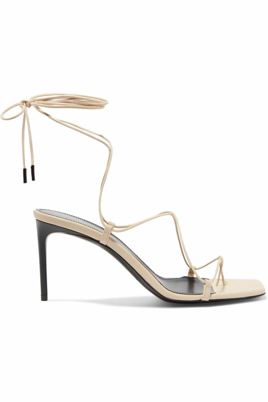 Klacksko med tunna band i krämbeige från Saint Laurent. Här kan du shoppa skon!