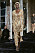 Svepande klänning i ljusbrunt från Acne Studios.