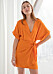 Kort orange klänning med knytdetalj från & Other Stories. Här kan du shoppa klänningen!