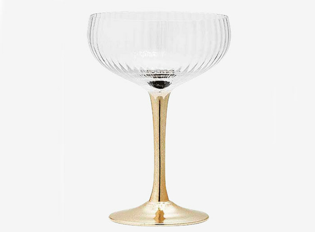 Champagneglas med guldig fot