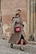 Janka Polliani i beige look och röd väska från Copenhagen Fashion Week steetstyle.