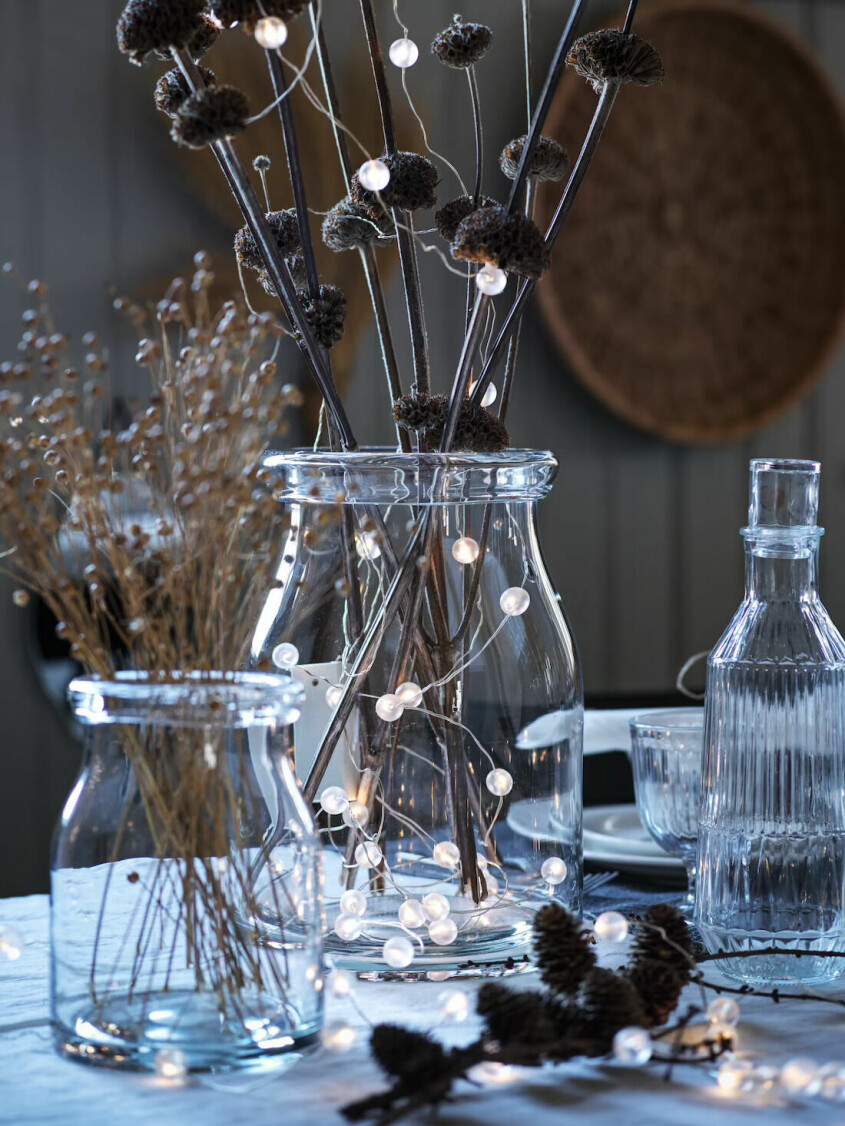 Complete the string of lights with natural, in-season ingredients, here's a winter eye-catcher. String light table setting inspiration