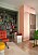 Kika in hos Emma och Dennis lekfulla och färgstarka lägenhet inred med pastellfärger på Södermalm, rosa kylskåp