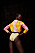 Modellen har på sig en rosa och gul tröja från Acne Studios tillsammans med en mönstrad baddräkt från Stella McCartney