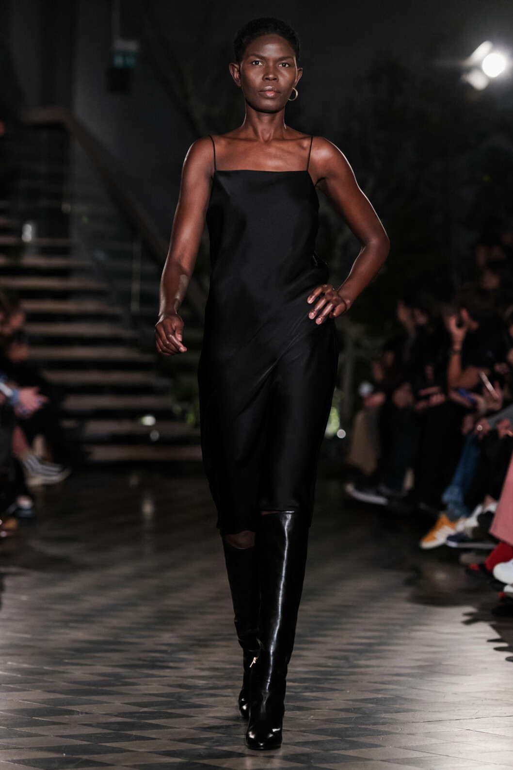 Filippa K AW 18, kvinna i svart satin klänning.