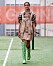Ganni SS20-visning på Copenhagen Fashion Week, leopardmönstrad klänning och gröna boots