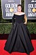 Kelly Clarkson bär en magisk svart askungen-klänning med gulddetaljer. 
