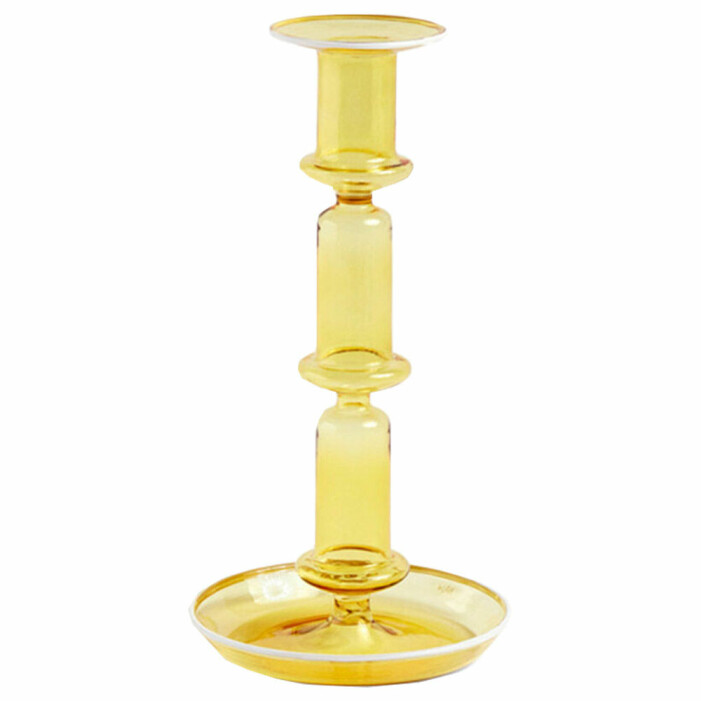 gul ljusstake i glas