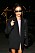 Hailey Bieber i svart kavaj, solglasögon och stövlar
