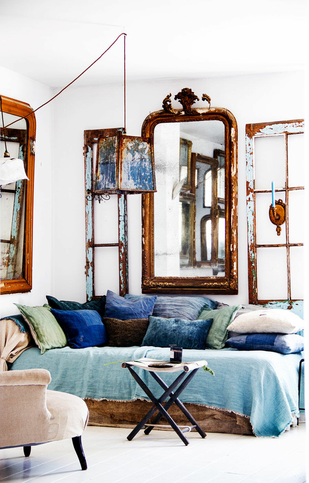 hans_blomquist_mirror_sofa_pillows_blue