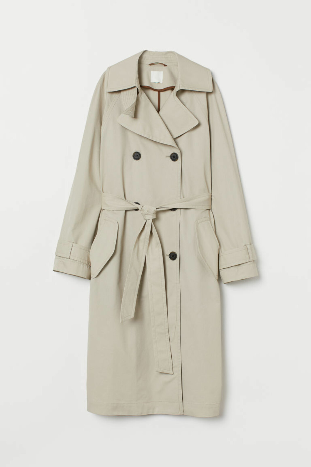 Klassisk beige trenchcoat med bältad midja och dubbelknäppning från H&M.