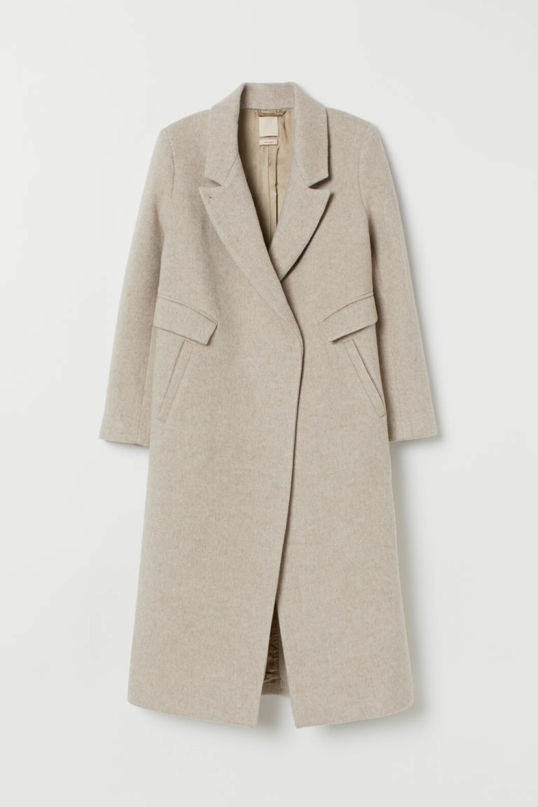 Lång kappa i rak modell och beige pudrig nyans från H&M.