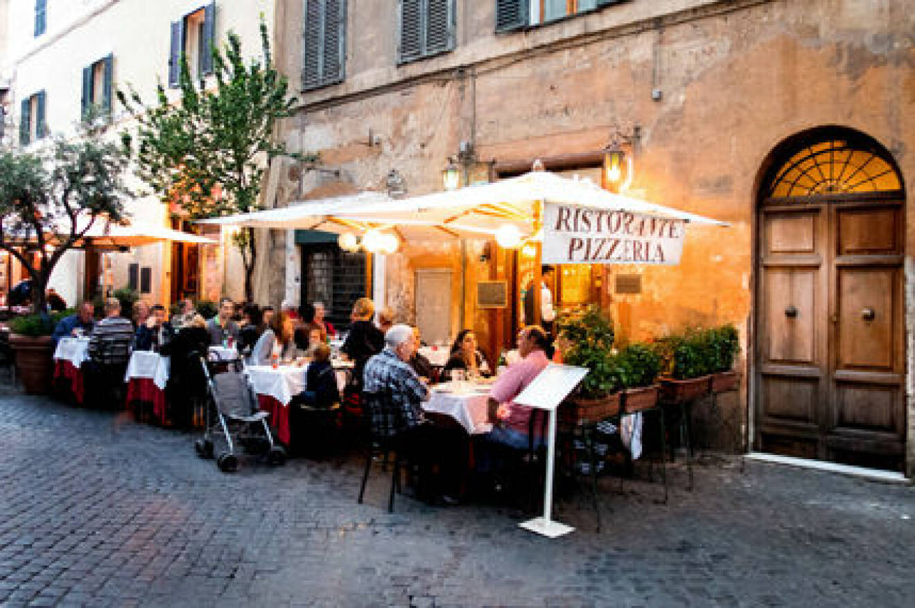 Outdoor restaurants in a cobbled street in Rome. Image shot 2014. Exact date unknown.