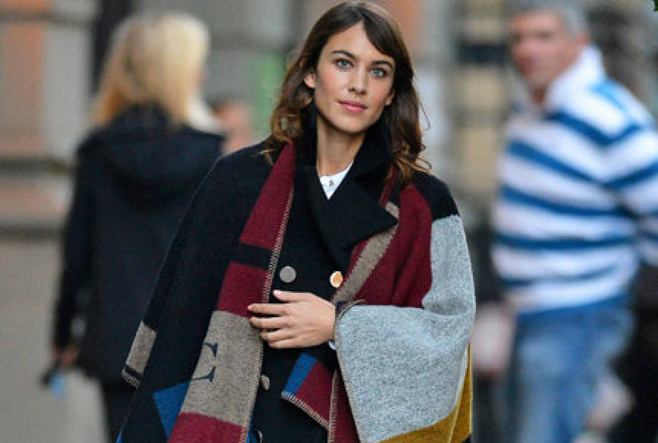 Alexa Chung seen draped in a Burberry cape with her initial on it as she leaves from a photo-shoot in SOHO, New York City