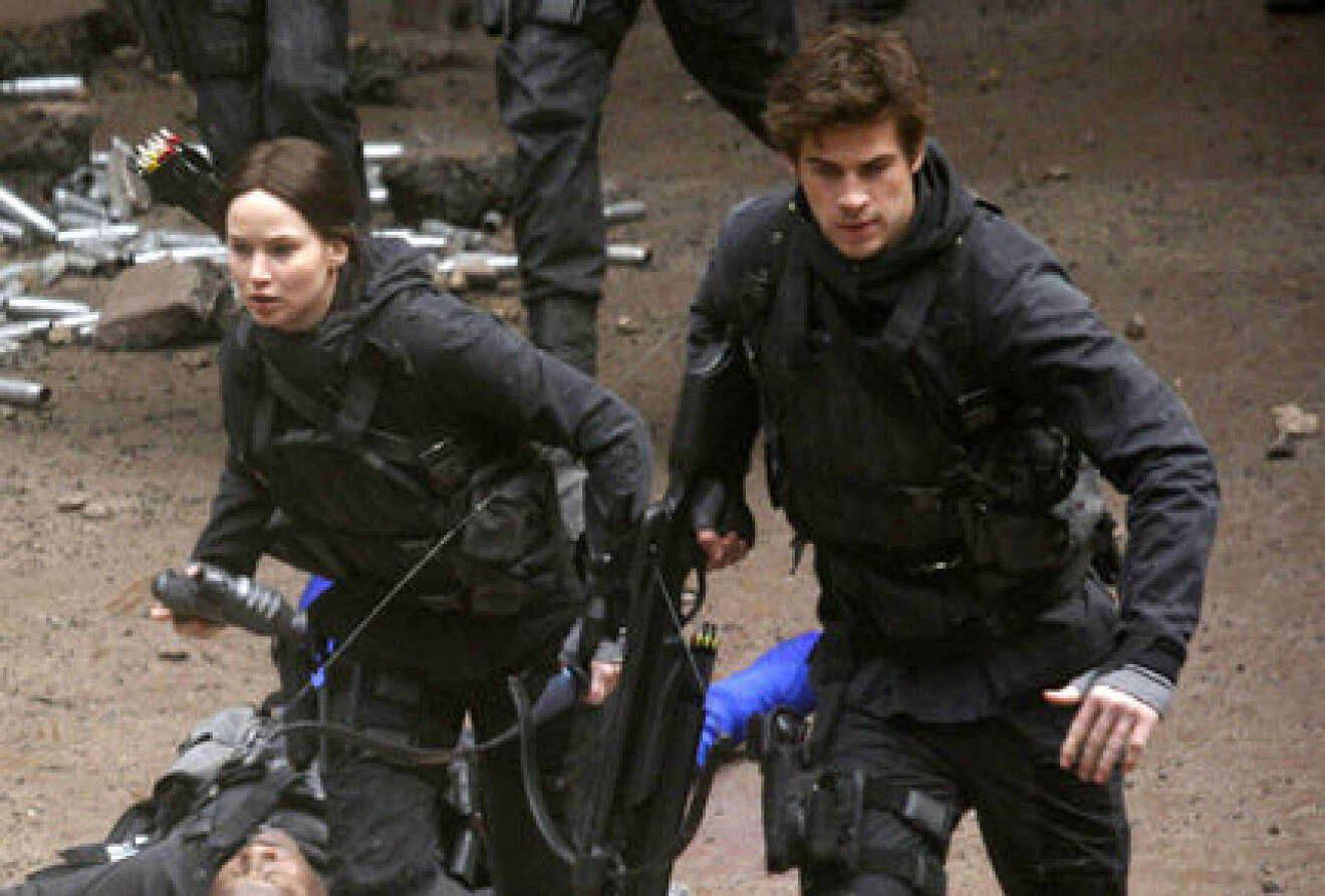 Jennifer Lawrence, Josh Hutcherson, and Liam Hemsworth film scenes for The Hunger Games: Mockingjay in Paris