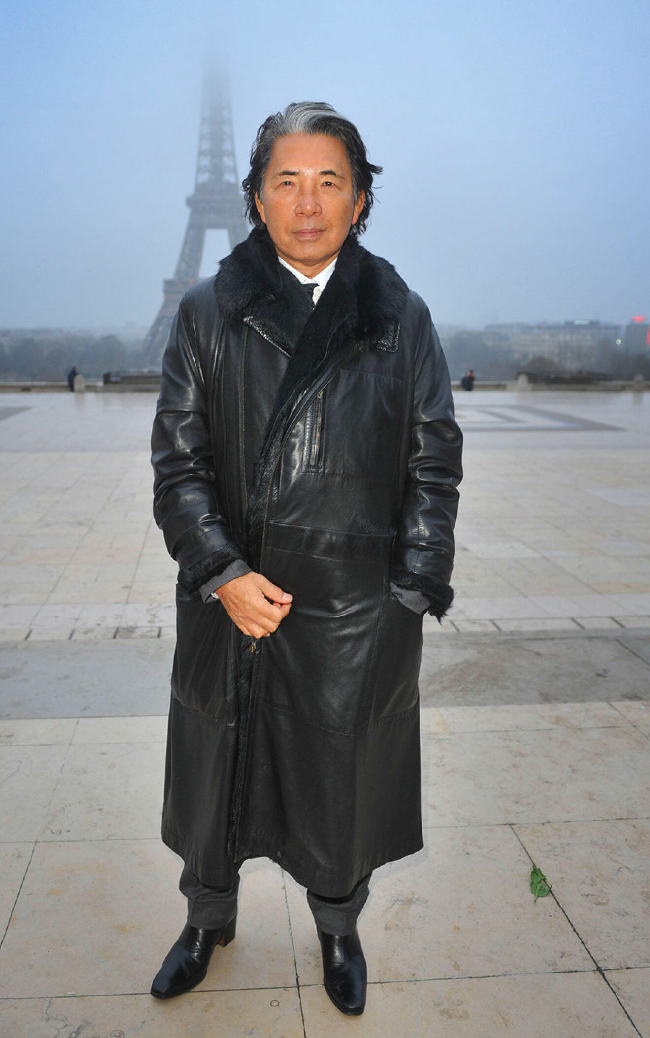 EMGCT6 11.MARCH.2012. PARIS FASHION DESIGNER KENZO TAKADA IN FRONT OF EIFFEL TOWER IN PARIS, FRANCE