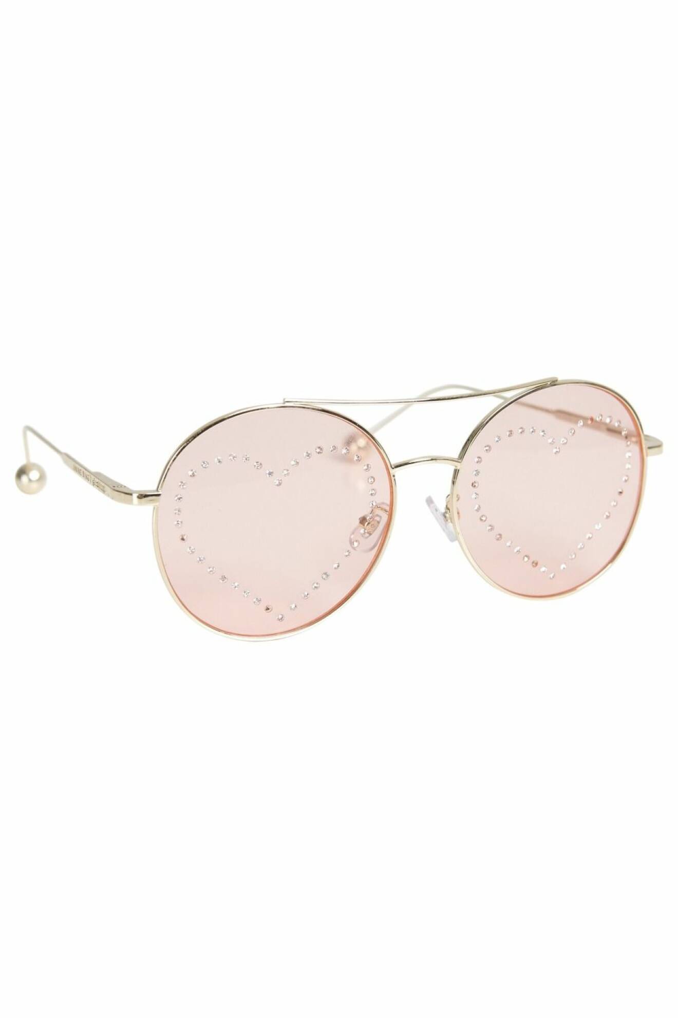 Runda solglasögon med ljusrosa glas från Anine Bing x Gina Tricot