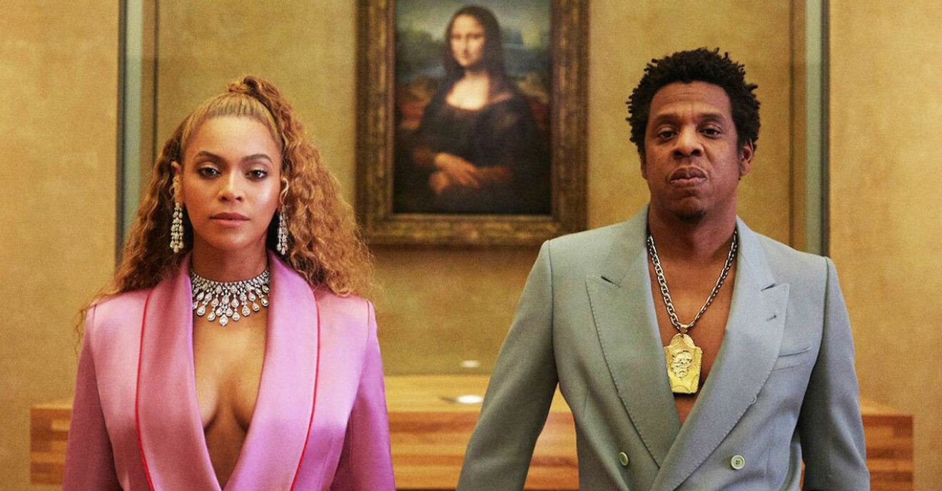 Beyoncé och Jay-Z framför en målning av Meghan Markle.