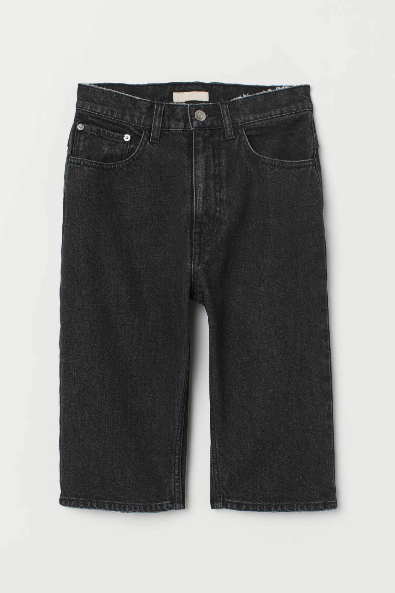 Knälånga jeans i stretchig denim och mörk tvätt, från H&M.