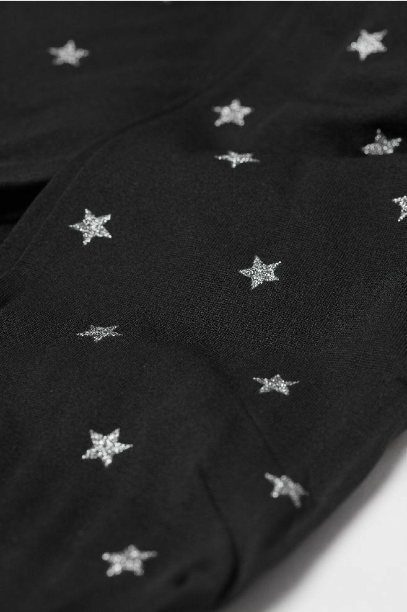 Strumpbyxor med silverstjärnor från H&M.