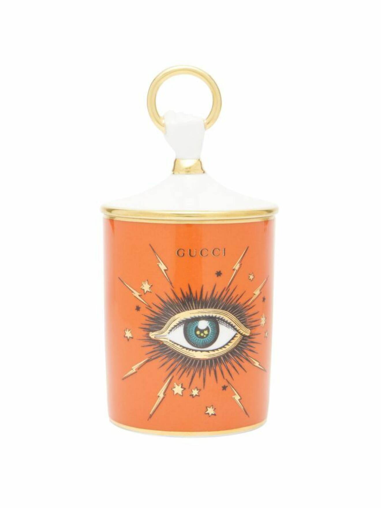 Lyxigt doftljus med en ikonisk ögonsymbol och vackert uttryck i orange från Gucci. 