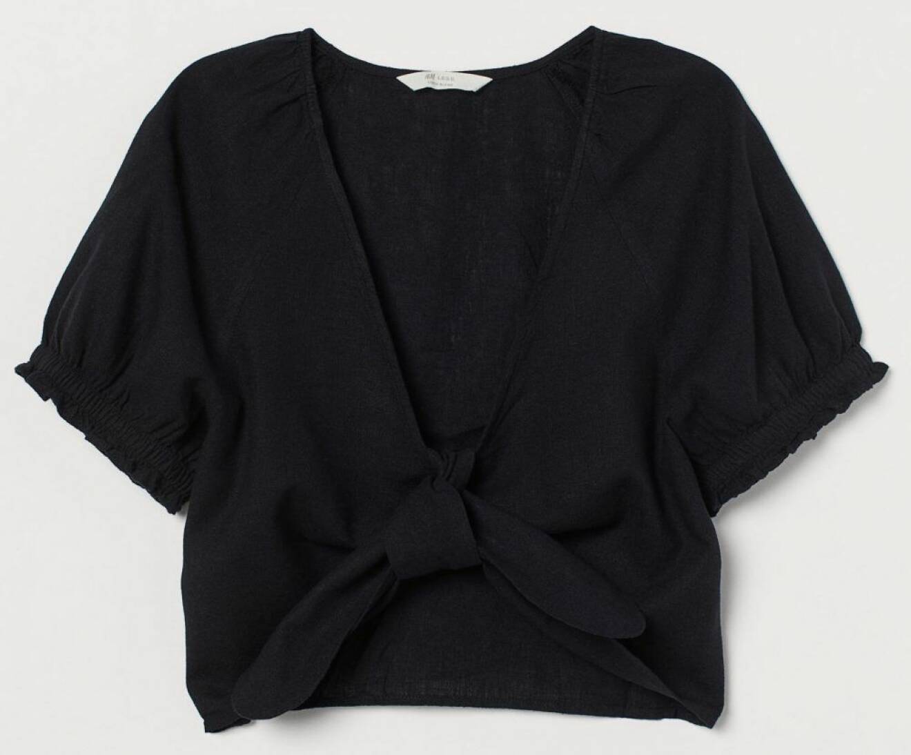 svart blus med knytdetalj från H&M.