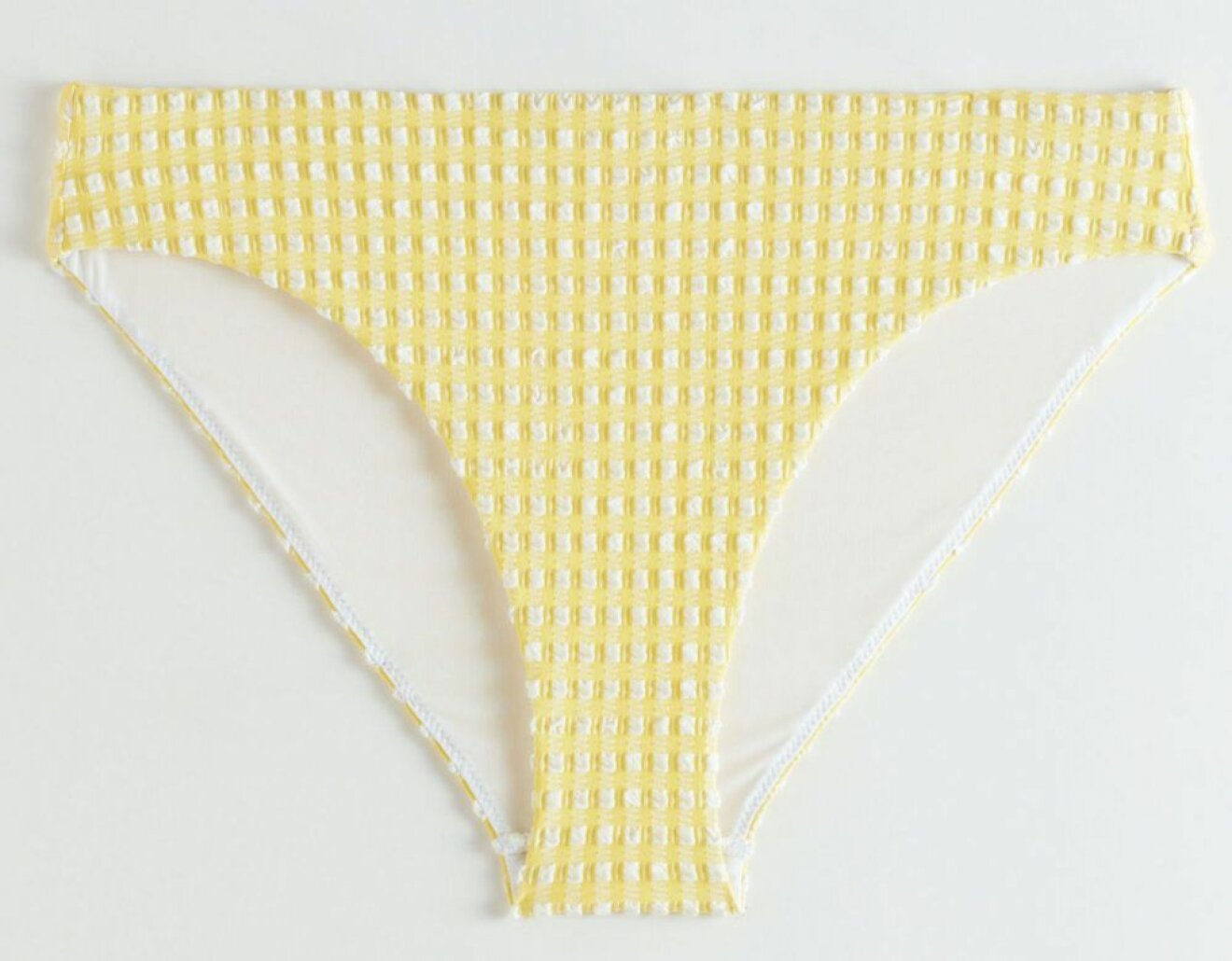 gul bikinitrosa med rutmönster från & Other stories.