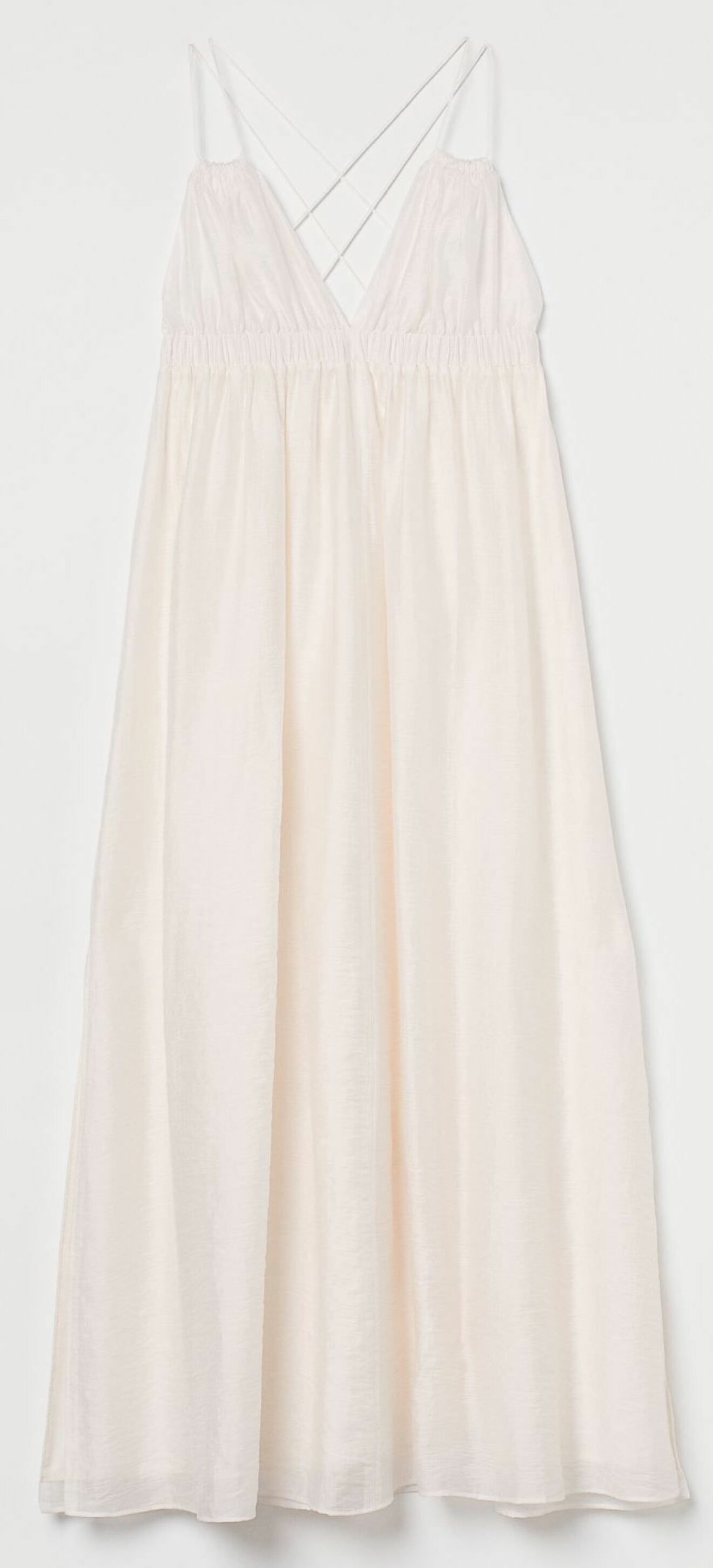 vit klänning med svepande fall från H&amp;M.