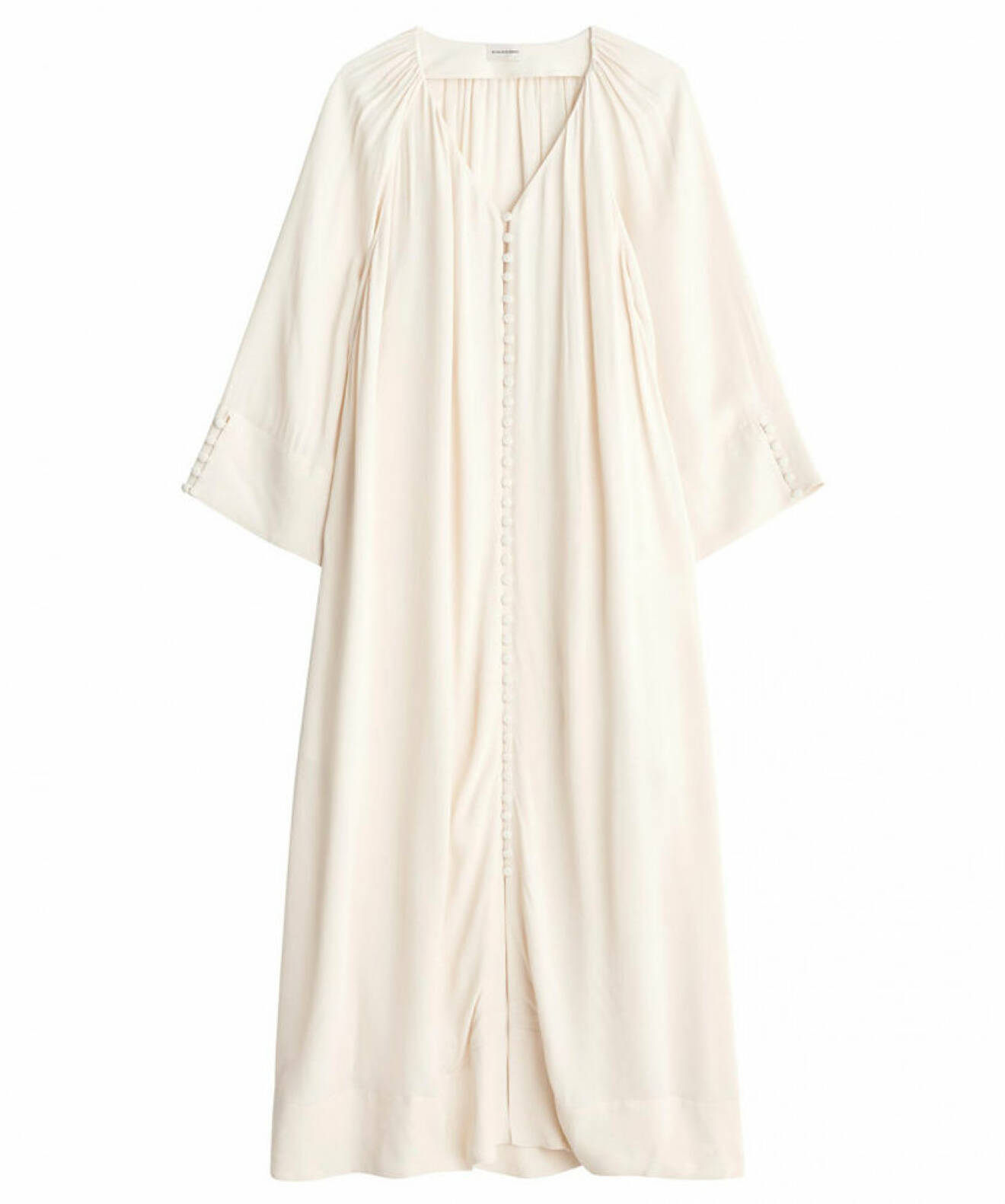 vit V-ringad klänning med knappar till sommaren 2021