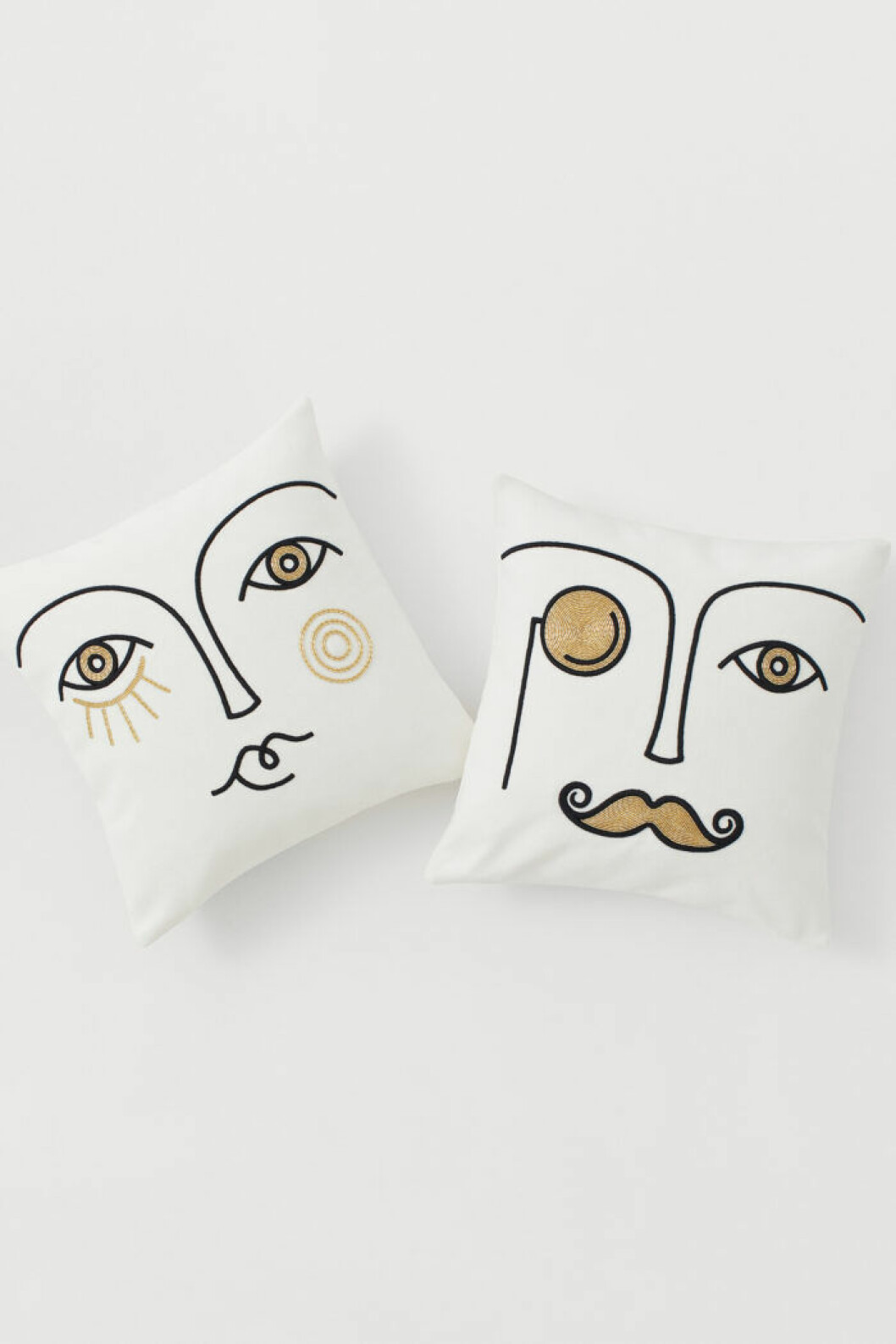 Vita kuddar med ansikten från Jonathan Adler x H&M