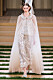Karl Lagerfelds design, skit cape med glitter och 30-talsinspirerad klänning.