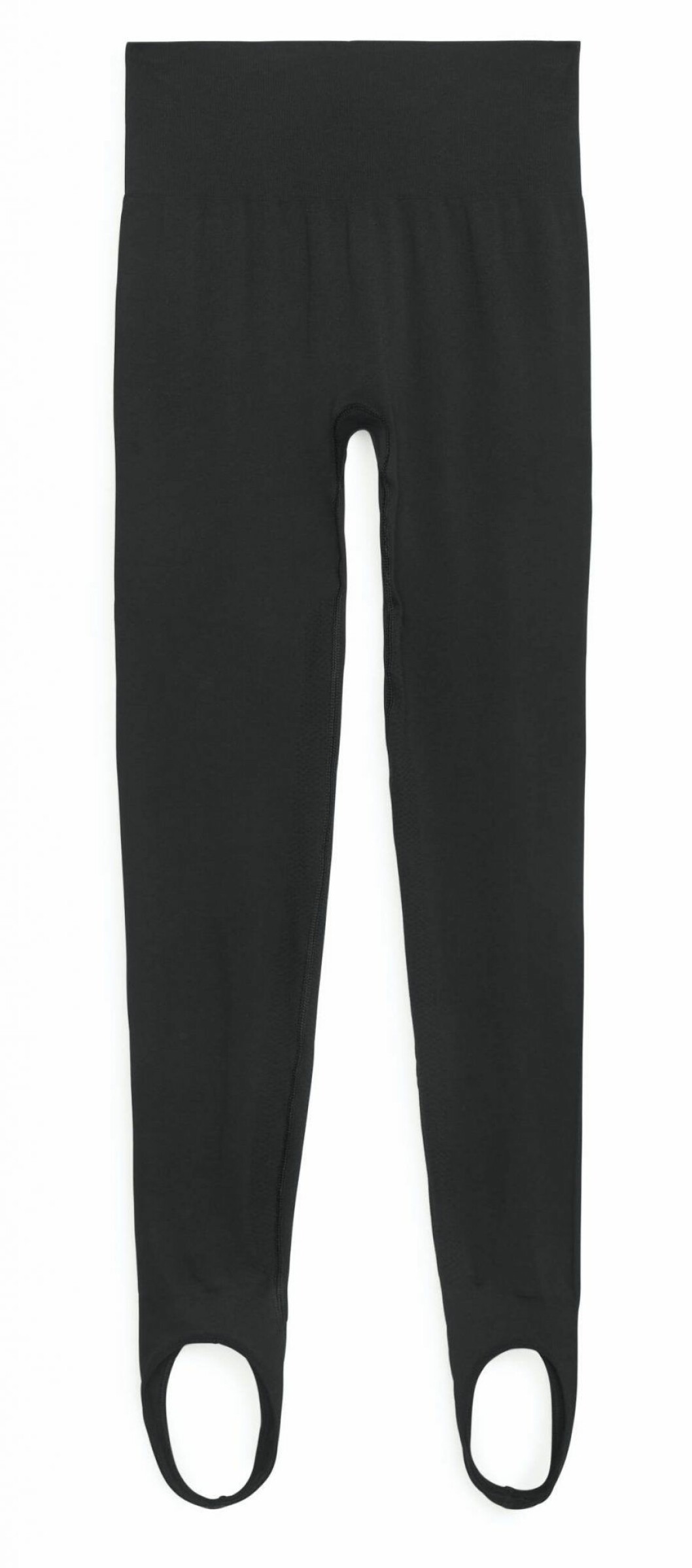 Svarta sömlösa leggings från Arket med stigbygel-detalj som håller plagget på plats