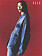 Fotomodellen bär en lång jeansjacka och jeanskjol, båda från Givenchy