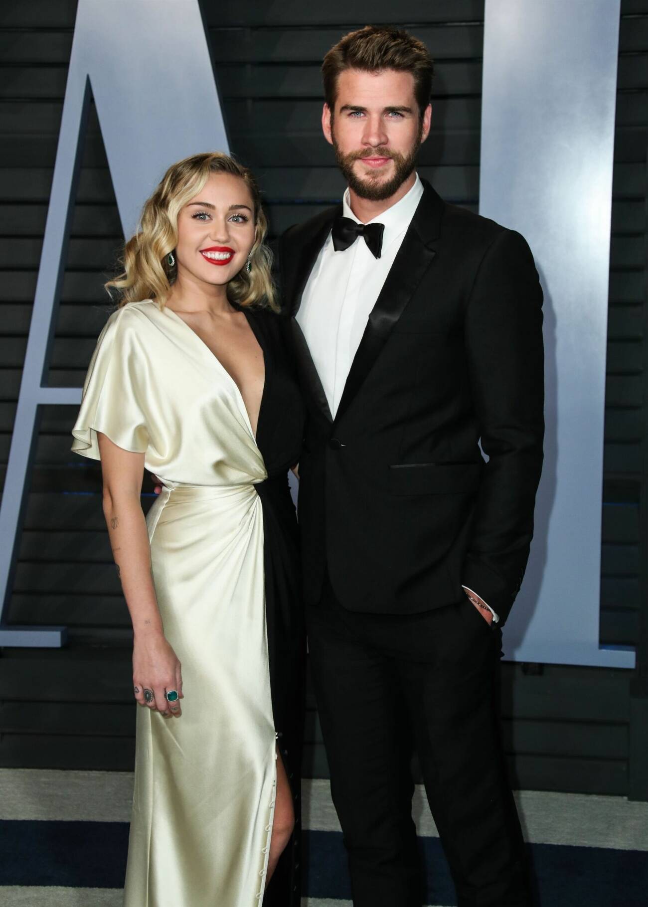 Miley Cyrus och Liam Hemsworth på Oscarsgalans efterfest 2018.