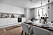 Modern kök i vitt och marmor i minihus på Södermalm