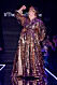 Guldglittrande paljettklänning i design av couturedesignern Frida Jonsvens.