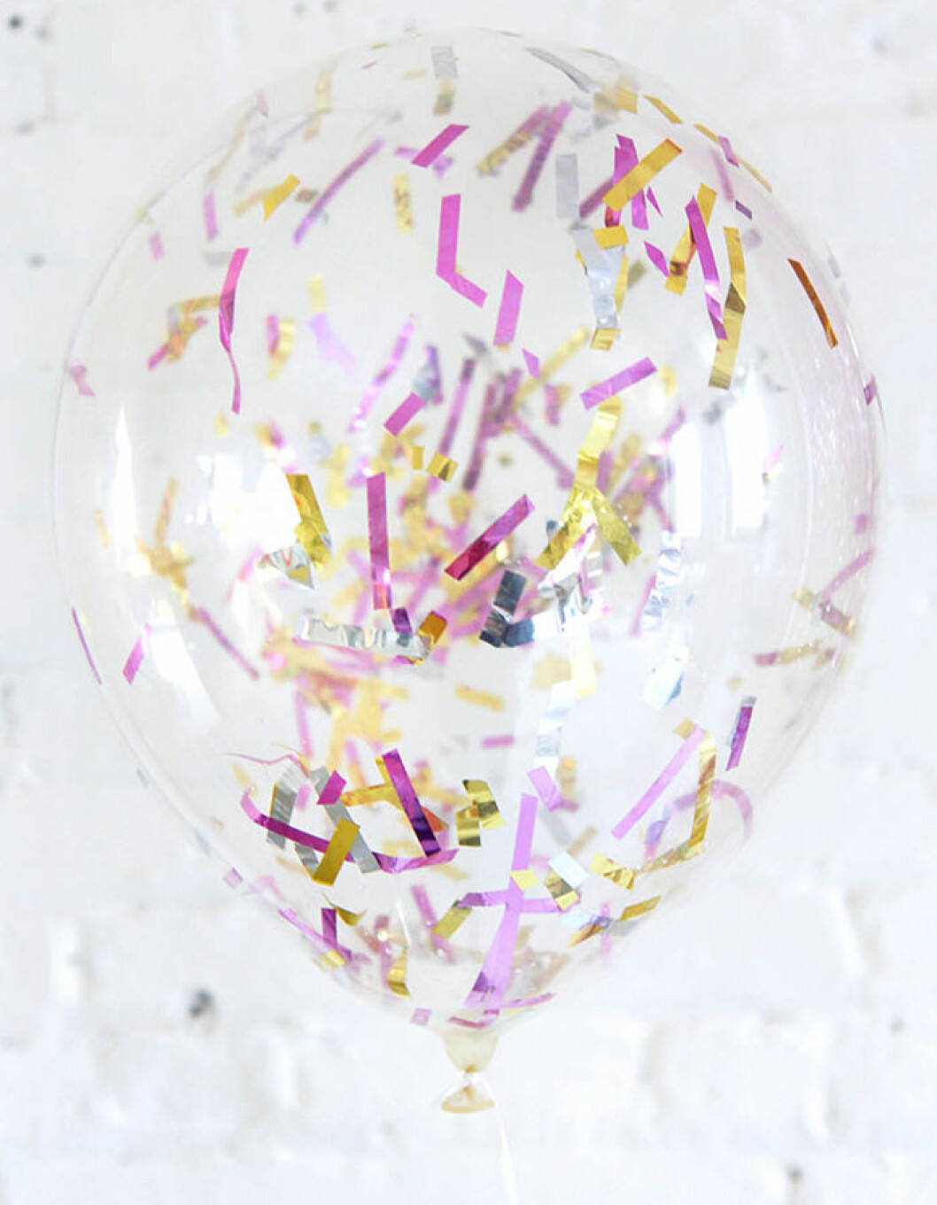 Foto: <a href="http://ispydiy.com/holiday-diy-new-years-eve-party/#more-7097" target="_blank" rel="noopener">Ispydiy.com</a> Konfettifyllda ballonger.