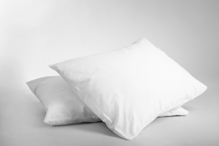 Blank soft pillows on light background Silver sleep från nap studio