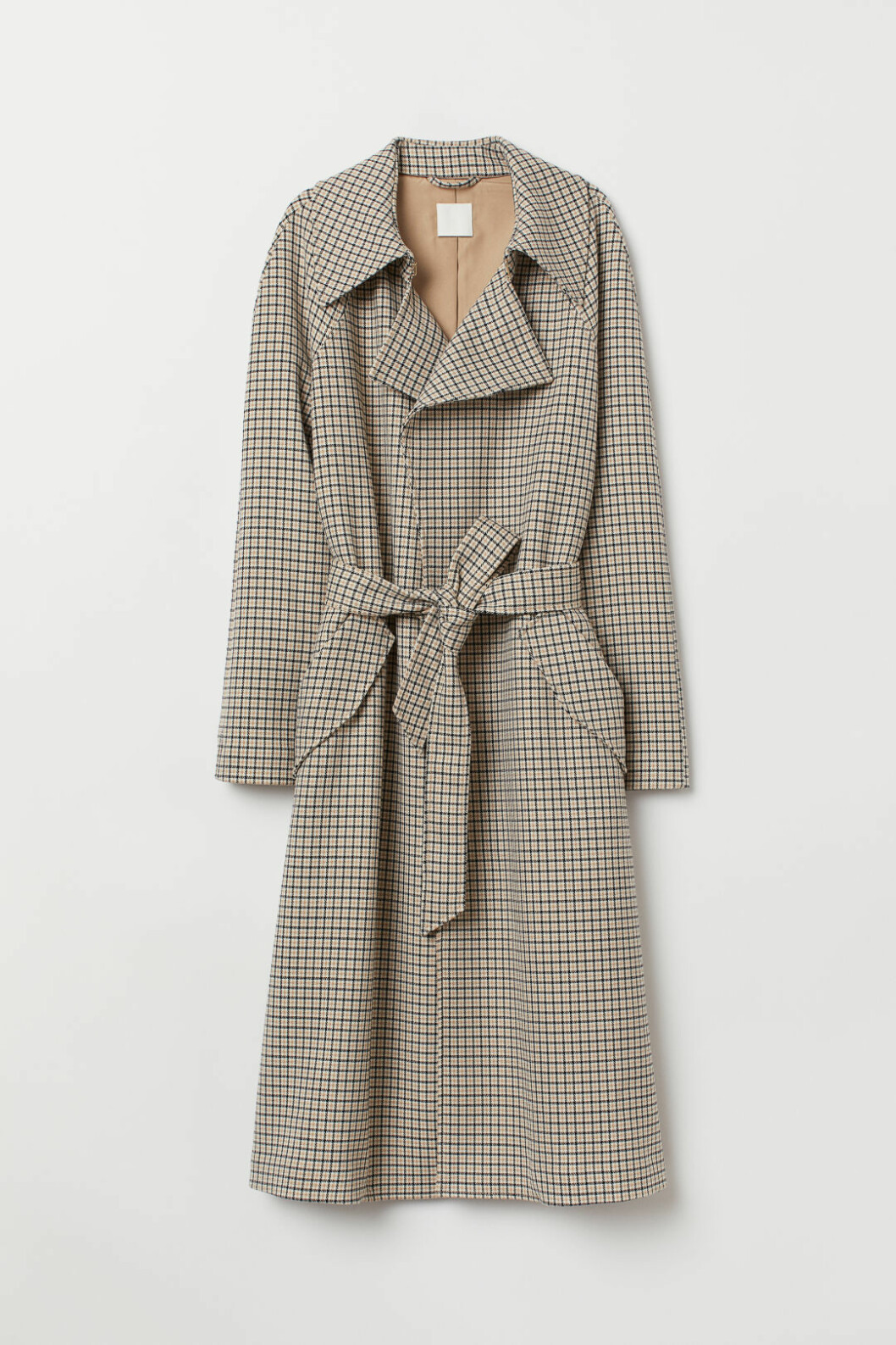 Rutig trenchcoat med knytdetalj i midjan från H&M.
