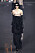 draperad klänning i svart med transparent glitteröverdel från Saint Laurent.