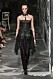 Christian Dior AW19/20, svart look med detaljer av spets och fransar.