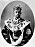 Kronprins Gustaf V med krona och mantel.