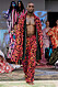 Byxor och kimonojacka i rött mönster på Selam Fessahayes AW19–visning på Fashion Week Stockholm