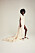 Modellen Shade bär en lång vit klänning från Lisa Helena Jacobsson