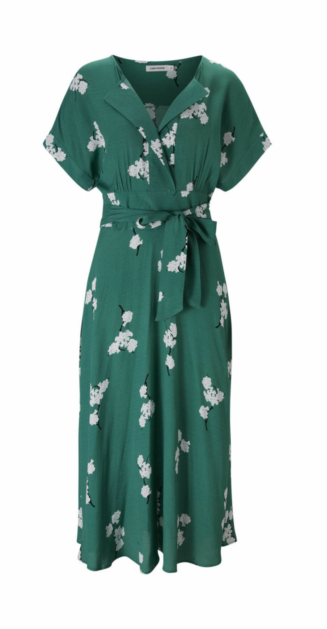 Grön klänning med vita blommor på