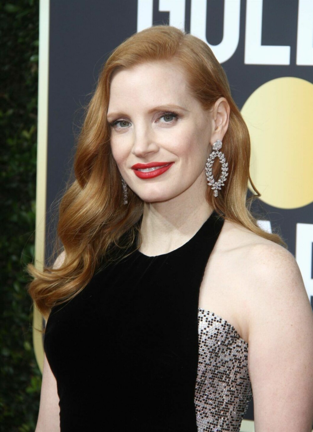 Den klassiska filmstjärnelooken med rött stift under Golden Globe 2018. Jessica Chastain under Golden Globe 2018.